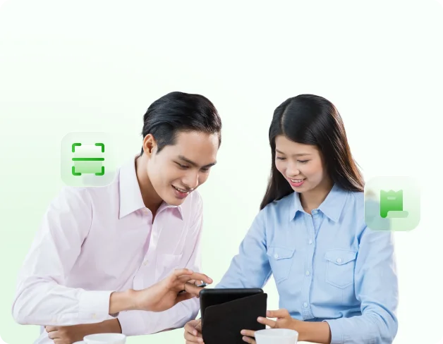 product-bookkeeper Two team members reviewing finance workflows across entities on a tablet